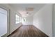 Sunroom with hardwood floors, sliding doors, and multiple windows at 34392 Broken Stone St, Webster, FL 33597