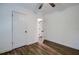 Spacious bedroom with hardwood floors and ceiling fan at 34392 Broken Stone St, Webster, FL 33597