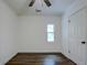 Spacious bedroom with hardwood floors and ceiling fan at 34392 Broken Stone St, Webster, FL 33597