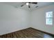 Spacious bedroom with hardwood floors and ceiling fan at 34392 Broken Stone St, Webster, FL 33597