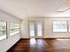 Bright sunroom features multiple windows and sliding glass doors at 34392 Broken Stone St, Webster, FL 33597