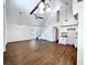 Spacious living room with high ceilings, a wood-look floor, and an open concept at 34392 Broken Stone St, Webster, FL 33597