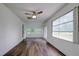 Sunroom with hardwood floors, sliding doors, and multiple windows at 34392 Broken Stone St, Webster, FL 33597