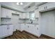Modern kitchen with white shaker cabinets and granite countertops at 34392 Broken Stone St, Webster, FL 33597