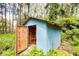 Small utility shed with an open door revealing plumbing at 34392 Broken Stone St, Webster, FL 33597