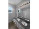Bright bathroom with double sinks, granite countertops, and a large mirror, perfect for a modern and functional space at 33083 Windelstraw Dr, Wesley Chapel, FL 33545