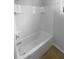 Clean bathroom with a white tiled bathtub and shower combination at 33083 Windelstraw Dr, Wesley Chapel, FL 33545