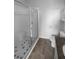 Bright bathroom featuring a glass shower, modern fixtures, and neutral tiling at 33083 Windelstraw Dr, Wesley Chapel, FL 33545