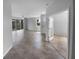 Bright open-concept living room with tile flooring and a ceiling fan at 33083 Windelstraw Dr, Wesley Chapel, FL 33545