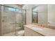 Modern bathroom with a walk-in shower and updated fixtures at 4915 Carova Way, Lakewood Ranch, FL 34211