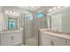 Elegant bathroom with double sinks and walk-in shower at 4915 Carova Way, Lakewood Ranch, FL 34211