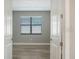 Bright bedroom with wood-look flooring and neutral walls at 4915 Carova Way, Lakewood Ranch, FL 34211