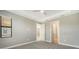 Spacious bedroom with ceiling fan and large window at 4915 Carova Way, Lakewood Ranch, FL 34211