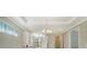 Bright hallway with high ceilings and recessed lighting, leading to other rooms at 4915 Carova Way, Lakewood Ranch, FL 34211