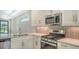 Kitchen boasts stainless steel appliances and granite countertops at 4915 Carova Way, Lakewood Ranch, FL 34211