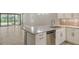 Kitchen island with granite countertops and stainless steel dishwasher at 4915 Carova Way, Lakewood Ranch, FL 34211