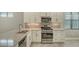 Modern kitchen featuring stainless steel appliances and granite countertops at 4915 Carova Way, Lakewood Ranch, FL 34211