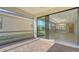 Screened lanai with brick pavers and sliding glass doors at 4915 Carova Way, Lakewood Ranch, FL 34211
