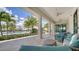 Covered patio with comfortable seating overlooking the pool at 4915 Carova Way, Lakewood Ranch, FL 34211