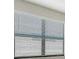 White mini blinds on a window at 4915 Carova Way, Lakewood Ranch, FL 34211