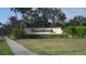 Stoneybrook community sign surrounded by lush landscaping and mature palm trees at 11774 Tempest Harbor Loop, Venice, FL 34292