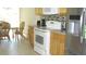 Bright kitchen with stainless steel appliances and a dining area with a window view at 11774 Tempest Harbor Loop, Venice, FL 34292