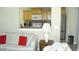Comfortable living room offering an adjacent kitchen space with modern appliances at 11774 Tempest Harbor Loop, Venice, FL 34292