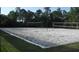 Outdoor sand volleyball court for recreational enjoyment amongst the trees at 11774 Tempest Harbor Loop, Venice, FL 34292