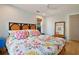 Spacious bedroom featuring a floral comforter and blue nightstand at 117 88Th Ave, Treasure Island, FL 33706
