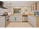 Modern kitchen with stainless steel appliances and light wood countertops at 117 88Th Ave, Treasure Island, FL 33706