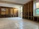 Under renovation, this living area has new tile and exposed framing at 117 88Th Ave, Treasure Island, FL 33706