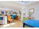 Open living area with teal couch and eclectic decor at 117 88Th Ave, Treasure Island, FL 33706