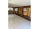 Large living area undergoing renovation with new tile flooring at 117 88Th Ave, Treasure Island, FL 33706