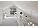 Spacious loft with skylights and a white railing overlooking the lower level at 117 88Th Ave, Treasure Island, FL 33706