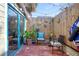 Brick patio with seating area and colorful decor at 117 88Th Ave, Treasure Island, FL 33706