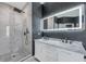 Modern bathroom with marble shower and double sinks at 8235 Bird Whistle Ln, Land O Lakes, FL 34637