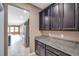 Modern kitchen with granite countertops and stainless steel appliances at 8235 Bird Whistle Ln, Land O Lakes, FL 34637