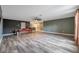Spacious game room with pool table and wood-look flooring at 8235 Bird Whistle Ln, Land O Lakes, FL 34637