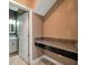 Convenient laundry area with built-in workspace and granite countertop at 8235 Bird Whistle Ln, Land O Lakes, FL 34637