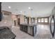 Spacious kitchen island, granite counters, and open floor plan at 8235 Bird Whistle Ln, Land O Lakes, FL 34637