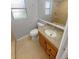 Bathroom featuring a granite countertop, vanity, toilet, shower and mirror at 3184 Wessex Way, Clearwater, FL 33761