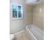Bathroom featuring a bathtub and tiled shower area offers a clean and functional space at 3184 Wessex Way, Clearwater, FL 33761