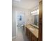 Bright bathroom featuring a granite vanity, neutral tones, and ample storage, offering a functional and stylish space at 3184 Wessex Way, Clearwater, FL 33761
