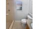 A bathroom featuring a tiled shower, neutral colors, and a granite vanity at 3184 Wessex Way, Clearwater, FL 33761