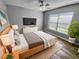 Cozy bedroom with contemporary decor, hardwood floors, and a large window offering natural light and a peaceful ambiance at 3184 Wessex Way, Clearwater, FL 33761