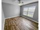 Inviting bedroom with hardwood floors, large window, and ample natural light creating a serene and comfortable atmosphere at 3184 Wessex Way, Clearwater, FL 33761