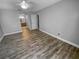 A bright, spacious bedroom with new floors, neutral paint, and an en-suite bathroom at 3184 Wessex Way, Clearwater, FL 33761