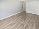 Spacious bedroom featuring a closet and wood-look flooring offers a comfortable and stylish living space at 3184 Wessex Way, Clearwater, FL 33761