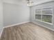 Bright bedroom with a window and ceiling fan, providing comfort and lots of light at 3184 Wessex Way, Clearwater, FL 33761