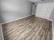 A spacious bedroom with new flooring and double door closet at 3184 Wessex Way, Clearwater, FL 33761